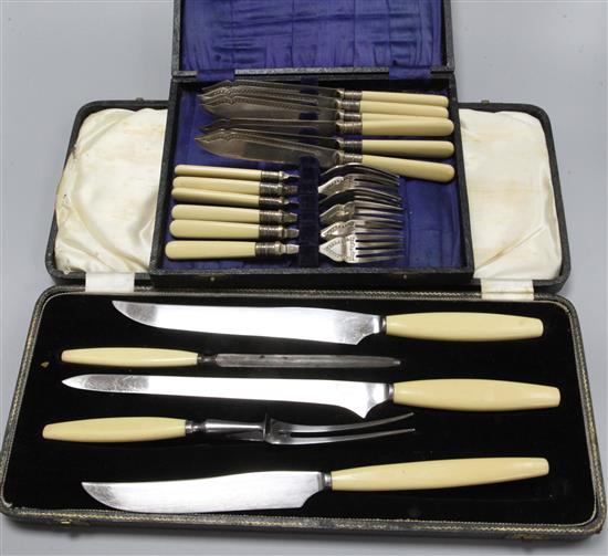 A set of fish knives and forks and a carving set